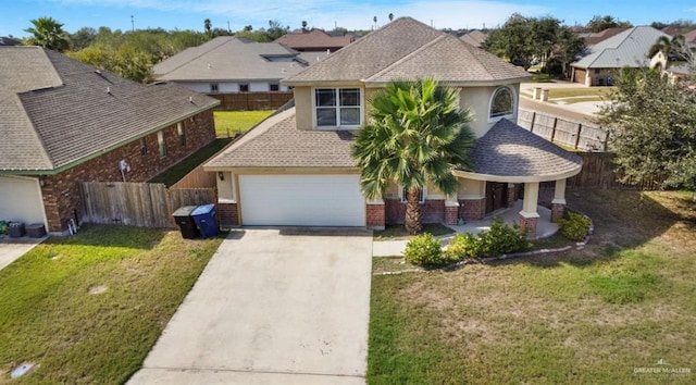 view of front of property with a front yard, a garage, and a porch