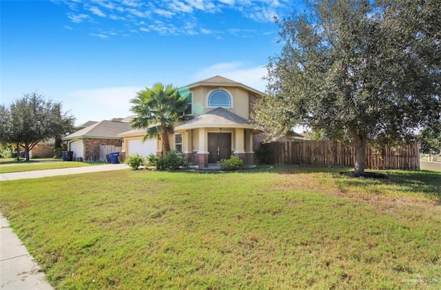 view of front of house featuring a front yard and a garage