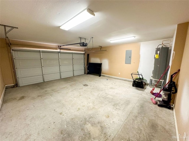 garage featuring a garage door opener, electric panel, and electric water heater