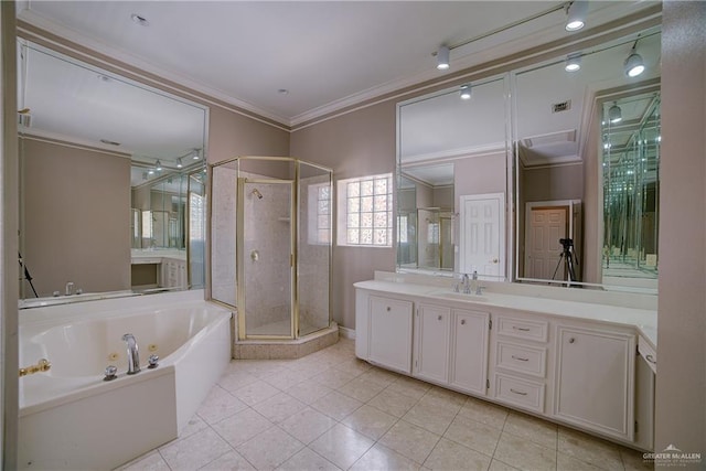 bathroom featuring tile patterned floors, vanity, crown molding, and plus walk in shower