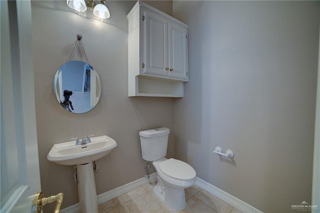 bathroom with tile patterned flooring and toilet