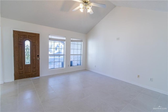 foyer featuring ceiling fan, light tile patterned floors, and lofted ceiling