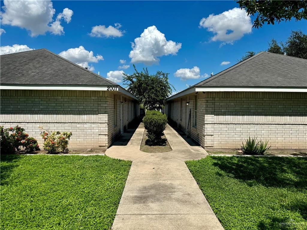 view of home's exterior with a lawn