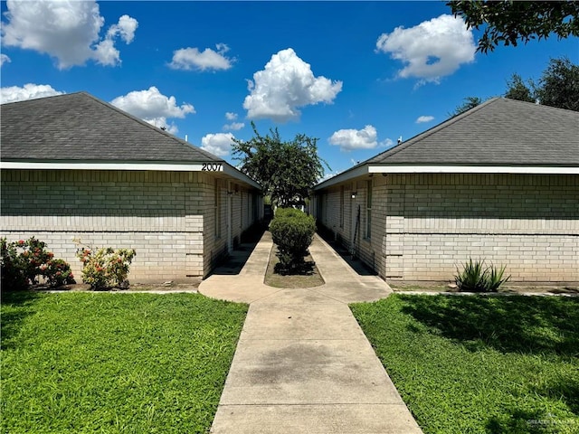 view of home's exterior with a lawn