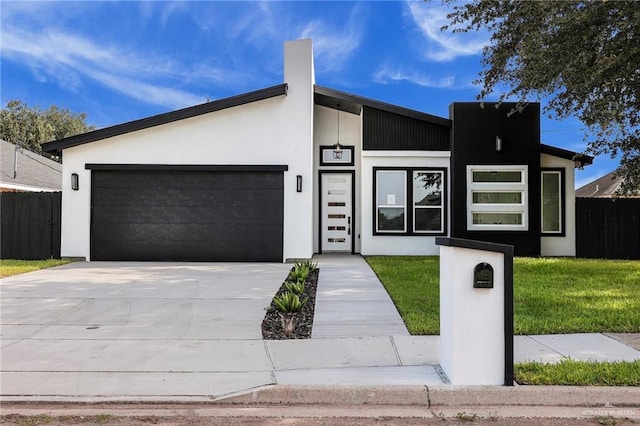 1915 Chandler Cir, Edinburg, TX 78542 - view of front of property featuring an attached garage, driveway, and stucco siding