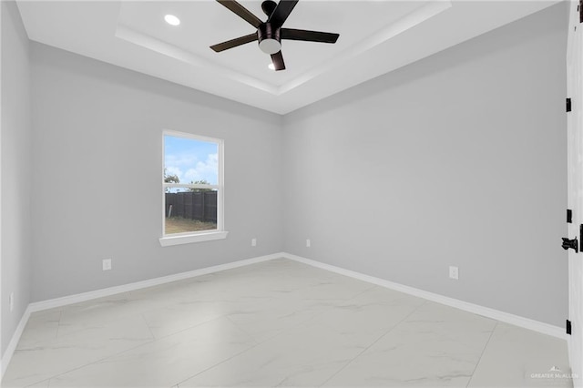 1915 Chandler Cir, Edinburg, TX 78542 - unfurnished room featuring light marble finish flooring, a tray ceiling, a ceiling fan, and recessed lighting