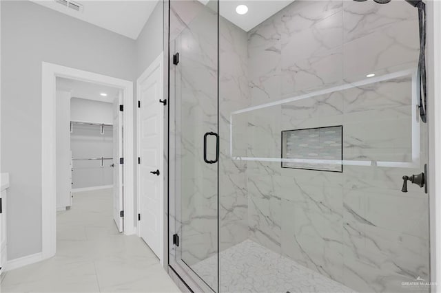 1915 Chandler Cir, Edinburg, TX 78542 - full bath featuring a marble finish shower, marble finish floors, a spacious closet, vanity, and recessed lighting