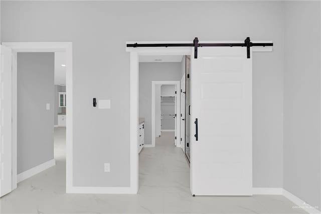 1915 Chandler Cir, Edinburg, TX 78542 - hallway with light marble finish flooring and a barn door