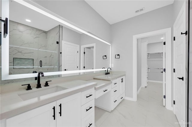 1915 Chandler Cir, Edinburg, TX 78542 - bathroom featuring marble look tiles, double vanity, a marble finish shower, a spacious closet, and recessed lighting