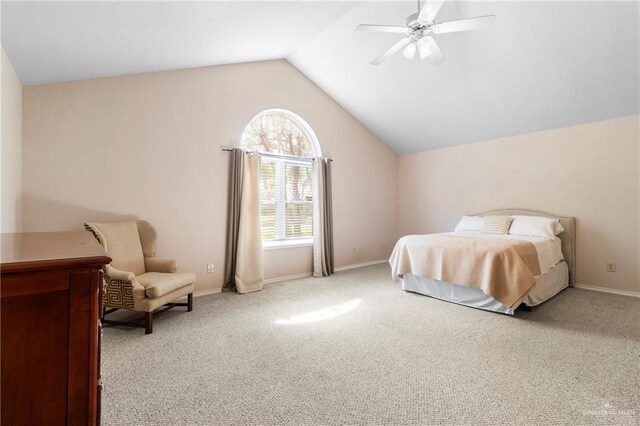 carpeted bedroom featuring ceiling fan, a textured ceiling, and vaulted ceiling