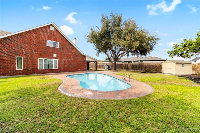 view of pool featuring a fenced in pool, a storage unit, a lawn, a fenced backyard, and an outdoor structure