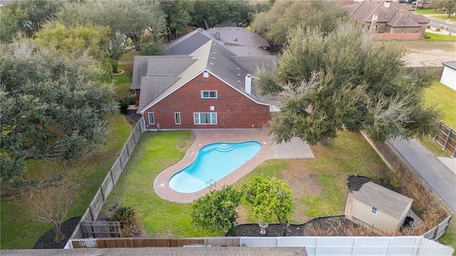 view of pool featuring a fenced backyard, a lawn, and a fenced in pool