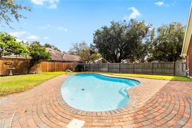 view of pool with a yard, a patio area, a fenced backyard, and a fenced in pool