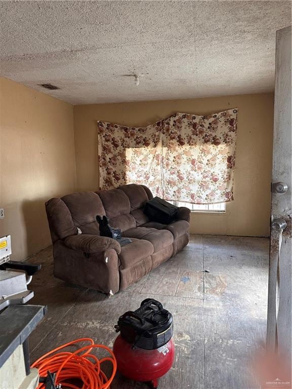 living room with a textured ceiling