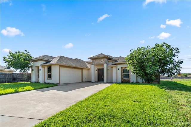4630 Kristine Dr, Harlingen, TX 78552 - prairie-style home with a front yard, an attached garage, fence, concrete driveway, and stucco siding