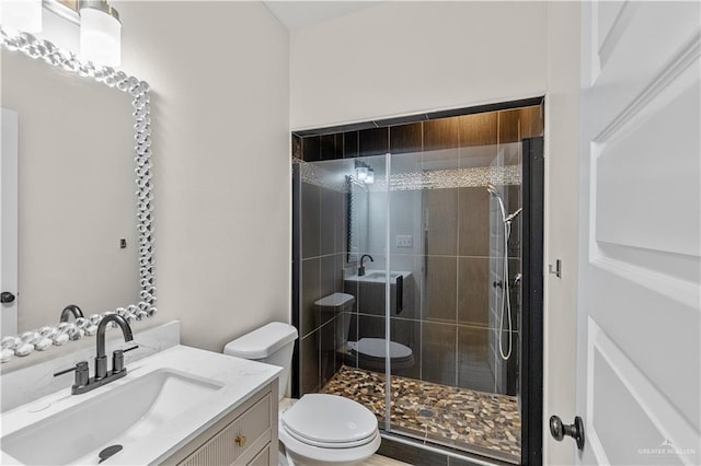 4630 Kristine Dr, Harlingen, TX 78552 - bathroom with vanity, a stall shower, and toilet