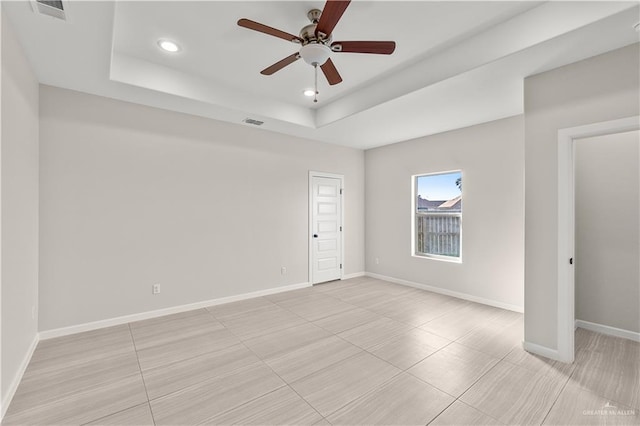4630 Kristine Dr, Harlingen, TX 78552 - empty room featuring visible vents, baseboards, a raised ceiling, a ceiling fan, and recessed lighting