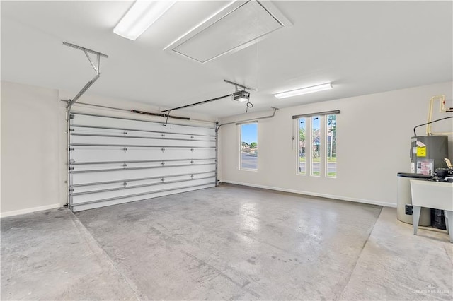 4630 Kristine Dr, Harlingen, TX 78552 - garage featuring water heater, baseboards, and a garage door opener