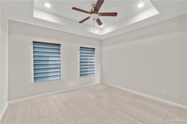 4630 Kristine Dr, Harlingen, TX 78552 - empty room with ceiling fan, a raised ceiling, recessed lighting, and baseboards