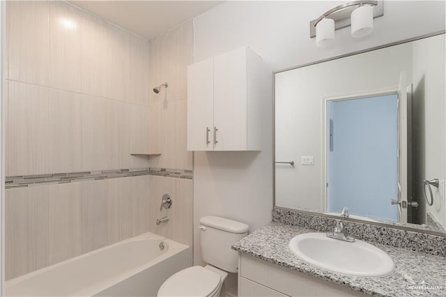 full bathroom featuring toilet, vanity, and shower / bathing tub combination