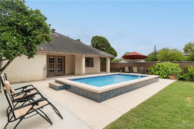 605 W Lozano St, Harlingen, TX 78550 - view of swimming pool with french doors, a fenced backyard, and a patio