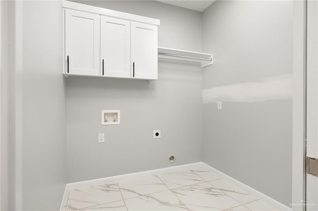 washroom with cabinets, washer hookup, and hookup for an electric dryer