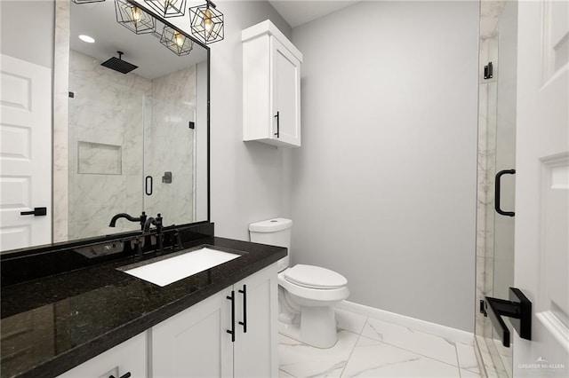 bathroom featuring an enclosed shower, vanity, and toilet