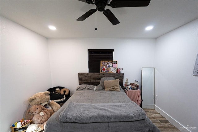 bedroom featuring wood-type flooring and ceiling fan