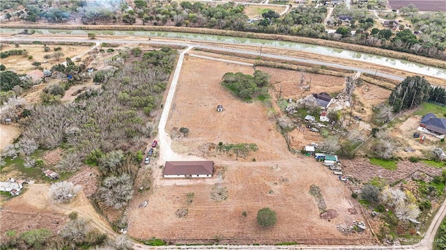 aerial view with a water view and a rural view