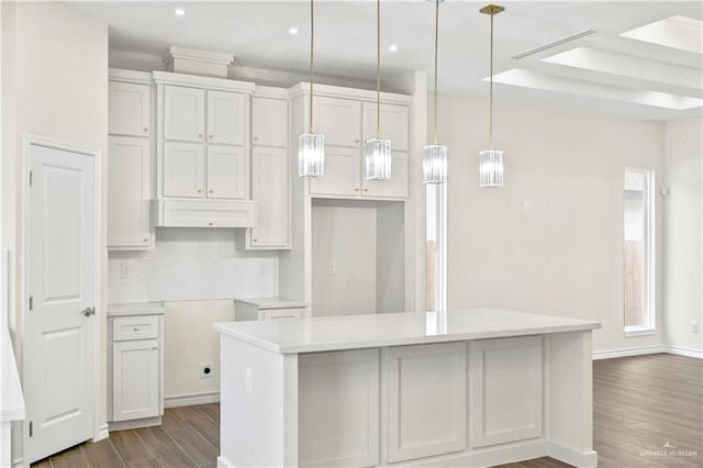 4312 Xenops Ave, Mcallen, TX 78503 - kitchen featuring wood finished floors, decorative backsplash, a kitchen island, decorative light fixtures, and recessed lighting