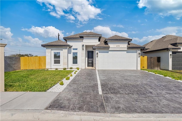 view of front facade with a front yard and a garage