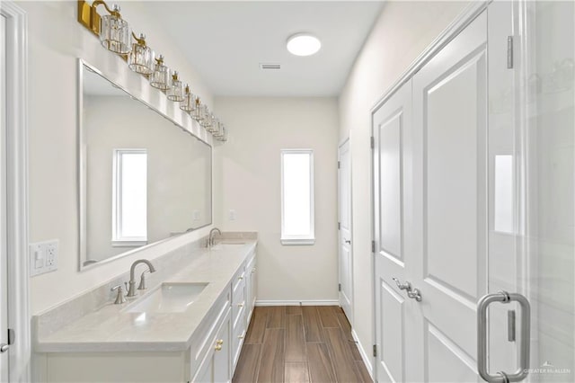4312 Xenops Ave, Mcallen, TX 78503 - full bath featuring double vanity, wood tiled floors, and baseboards