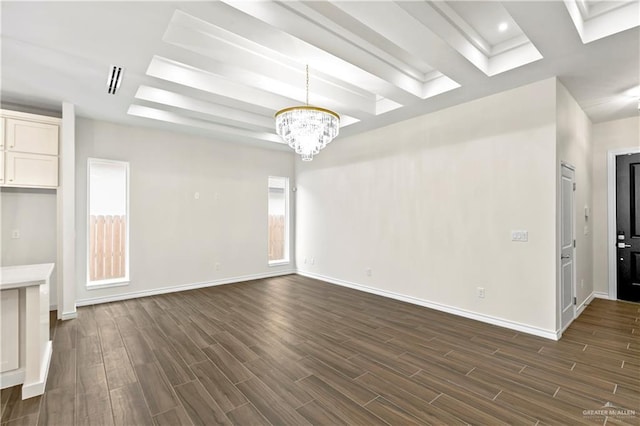 4312 Xenops Ave, Mcallen, TX 78503 - unfurnished living room featuring dark wood-type flooring, a chandelier, and baseboards