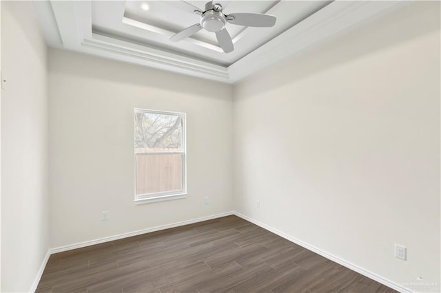4312 Xenops Ave, Mcallen, TX 78503 - unfurnished room with dark wood-style flooring, a tray ceiling, baseboards, and a ceiling fan