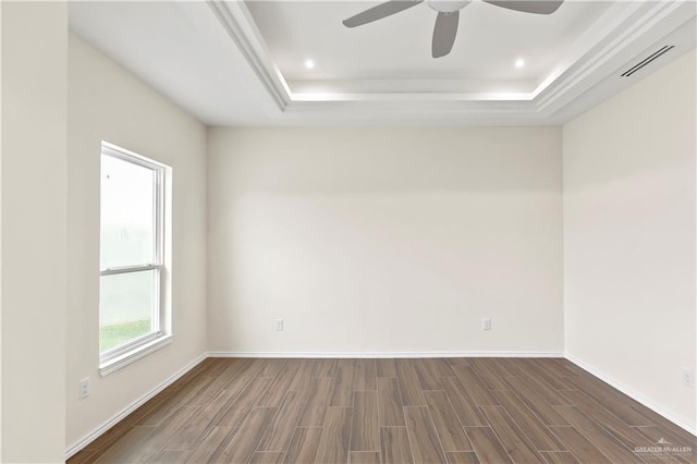 4312 Xenops Ave, Mcallen, TX 78503 - spare room with a tray ceiling, wood finish floors, a ceiling fan, baseboards, and recessed lighting