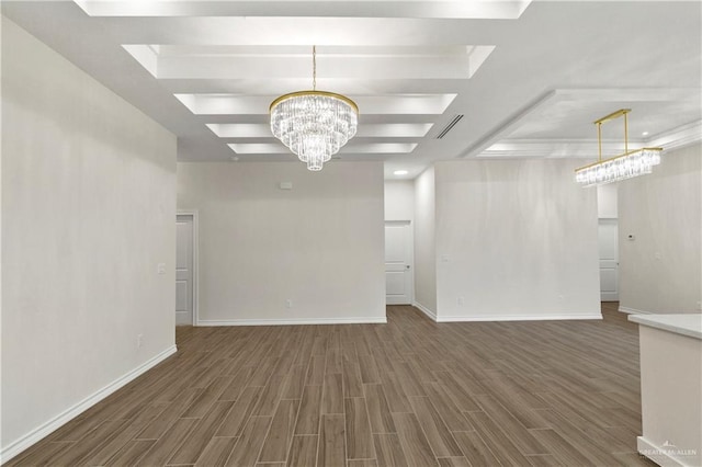 4312 Xenops Ave, Mcallen, TX 78503 - unfurnished living room with a tray ceiling, wood finished floors, a chandelier, and baseboards