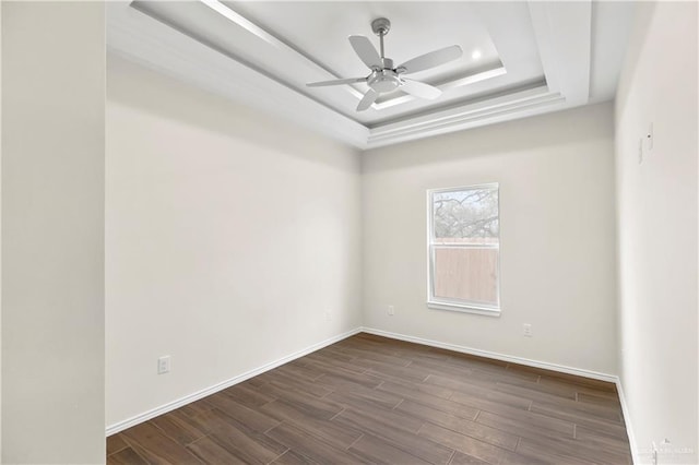 4312 Xenops Ave, Mcallen, TX 78503 - spare room with dark wood finished floors, ceiling fan, baseboards, and a tray ceiling