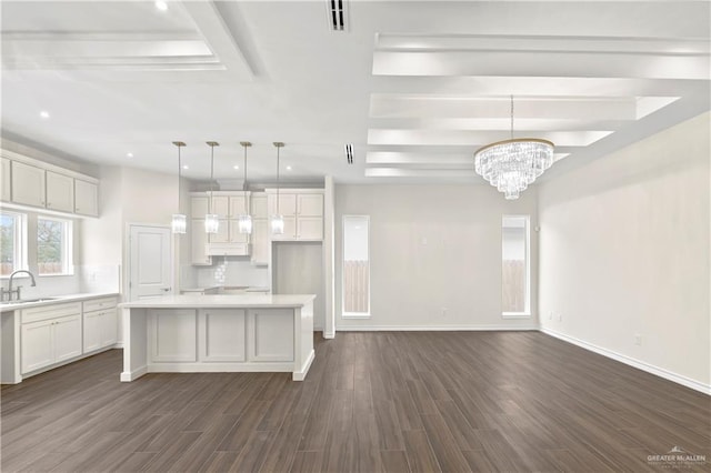 4312 Xenops Ave, Mcallen, TX 78503 - kitchen featuring white cabinetry, a sink, dark wood finished floors, light countertops, and a raised ceiling
