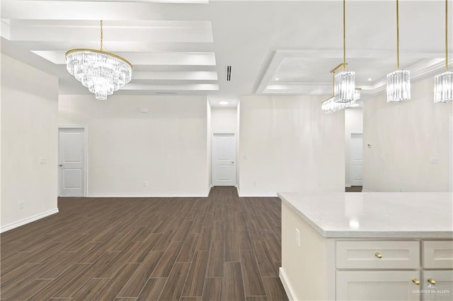 4312 Xenops Ave, Mcallen, TX 78503 - unfurnished living room featuring a tray ceiling, a chandelier, dark wood-style floors, and baseboards
