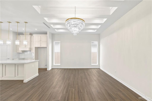 4312 Xenops Ave, Mcallen, TX 78503 - unfurnished living room with a chandelier, dark wood-style flooring, and baseboards