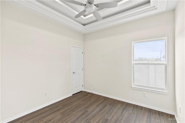 4312 Xenops Ave, Mcallen, TX 78503 - spare room with a raised ceiling, dark wood-style floors, ceiling fan, and baseboards
