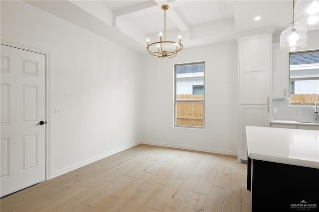 1305 Franklin Ave, Alton, TX 78573 - unfurnished dining area featuring coffered ceiling, light wood-style flooring, a chandelier, healthy amount of natural light, and beamed ceiling