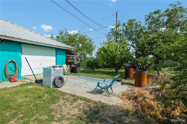 100 W Mesquite St, Sullivan City, TX 78595 - view of yard featuring a detached garage and an outbuilding