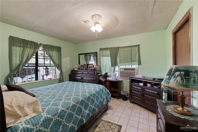 100 W Mesquite St, Sullivan City, TX 78595 - bedroom featuring cooling unit, visible vents, and a textured ceiling