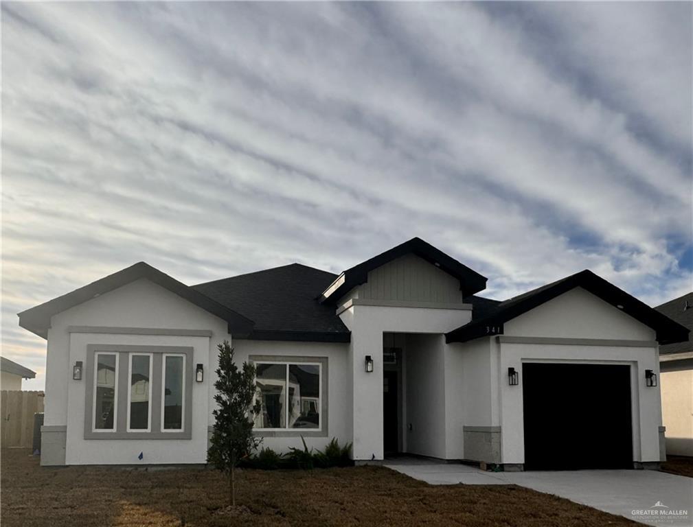 ranch-style house featuring a garage