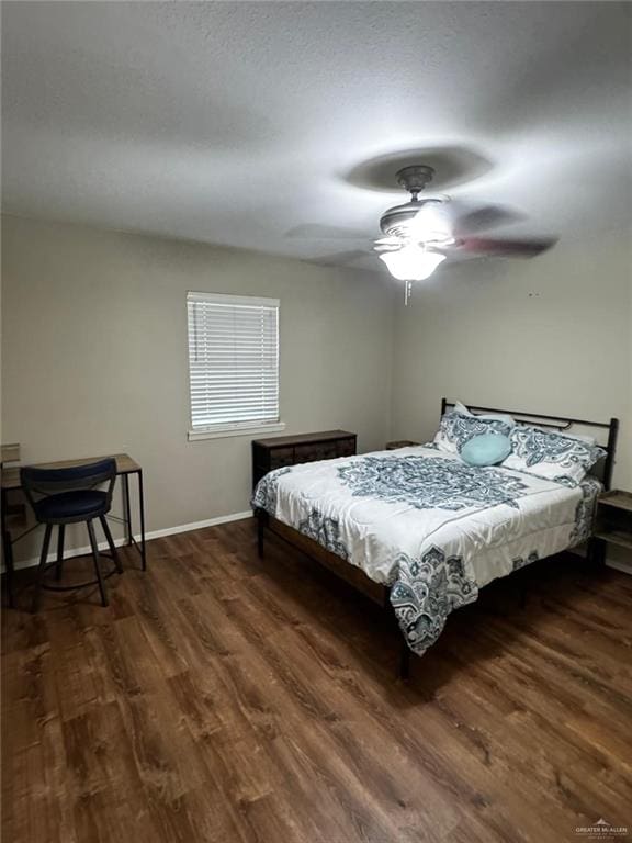 1108 Ash Dr, Weslaco, TX 78596 - bedroom featuring wood finished floors, baseboards, and ceiling fan