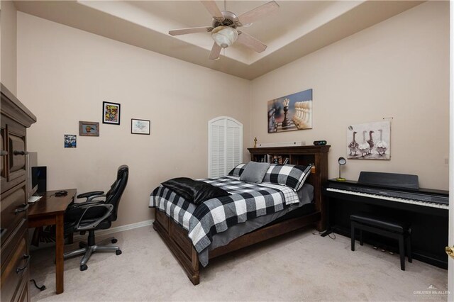 bedroom featuring light colored carpet and ceiling fan