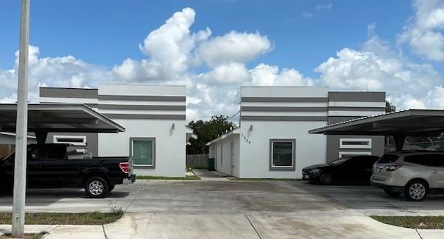 view of property exterior with a carport