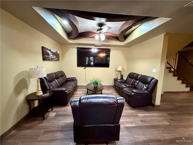 812 W Falcon Ave, Pharr, TX 78577 - living area featuring a ceiling fan, baseboards, a tray ceiling, stairs, and wood finished floors