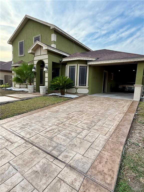 812 W Falcon Ave, Pharr, TX 78577 - view of front of home featuring concrete driveway and stucco siding